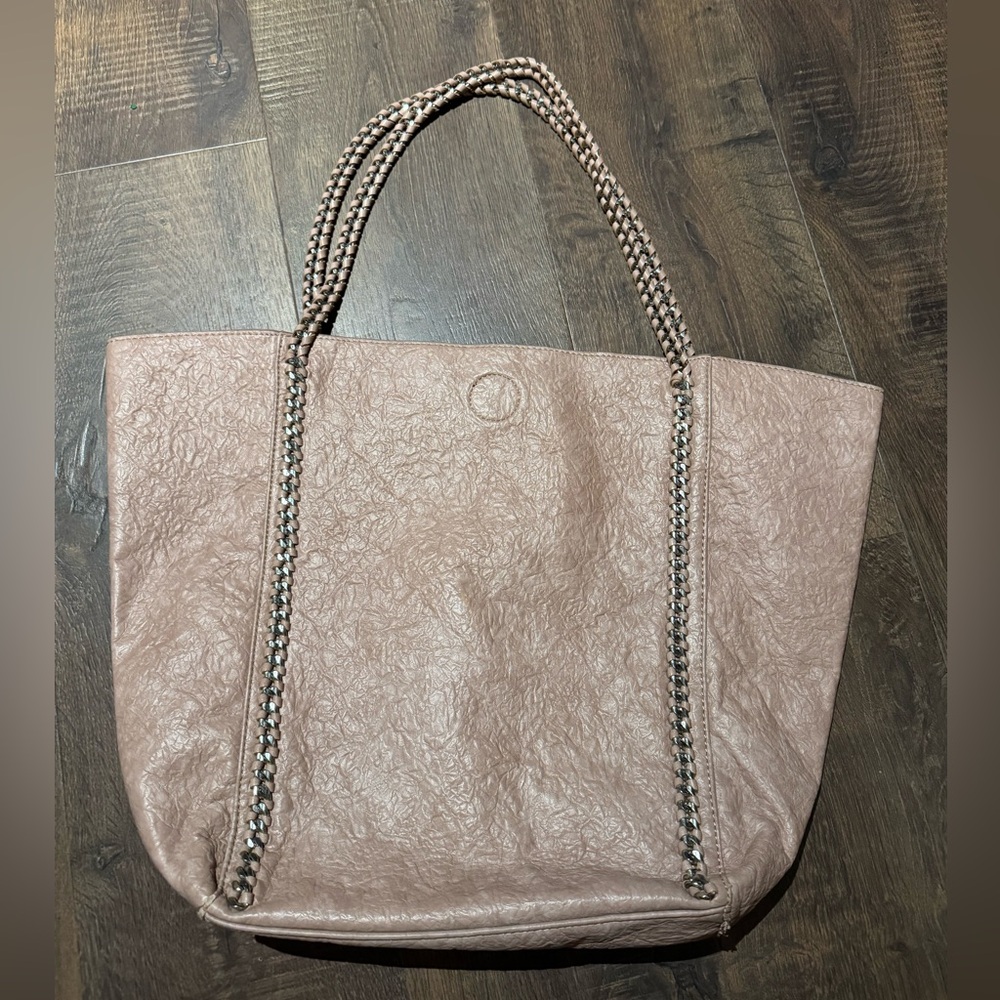 Blush pink colored shoulder bag with chain straps